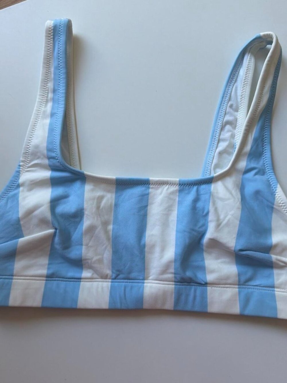 White and blue vertical striped sports bra